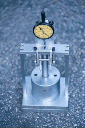 Precision gauge mounted on a metal stand